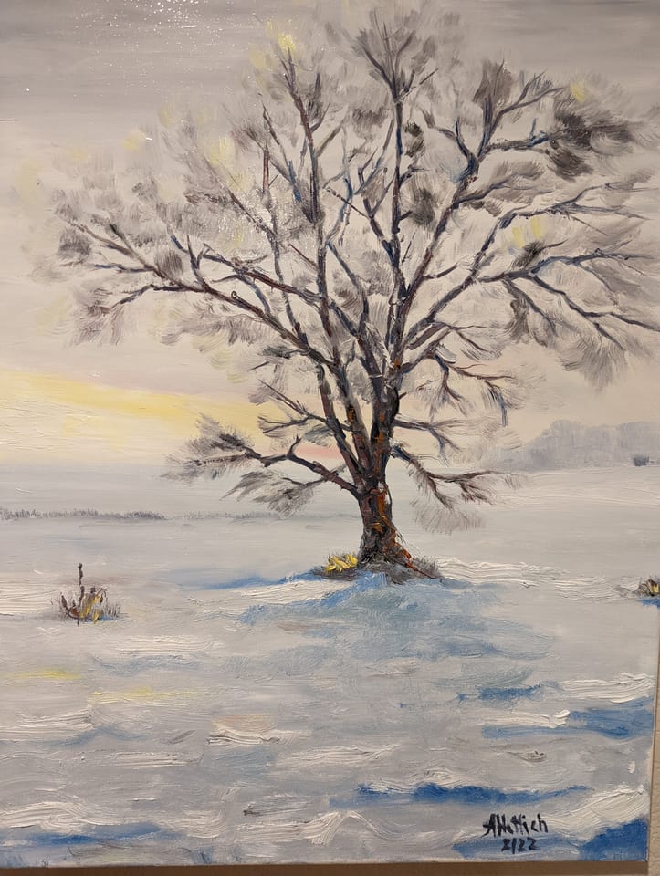A painting of a lone snow-laden tree in a winter field at dusk, signed A. Hettich 2/22.