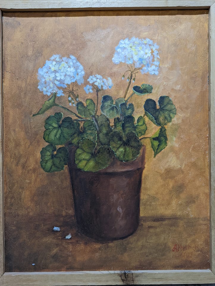 A painting of a white geranium in a brown pot against a gold ground, in a light wood frame, signed A. Hettich 6/87.